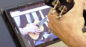 Online Guitar Lessons For Adults on a tablet